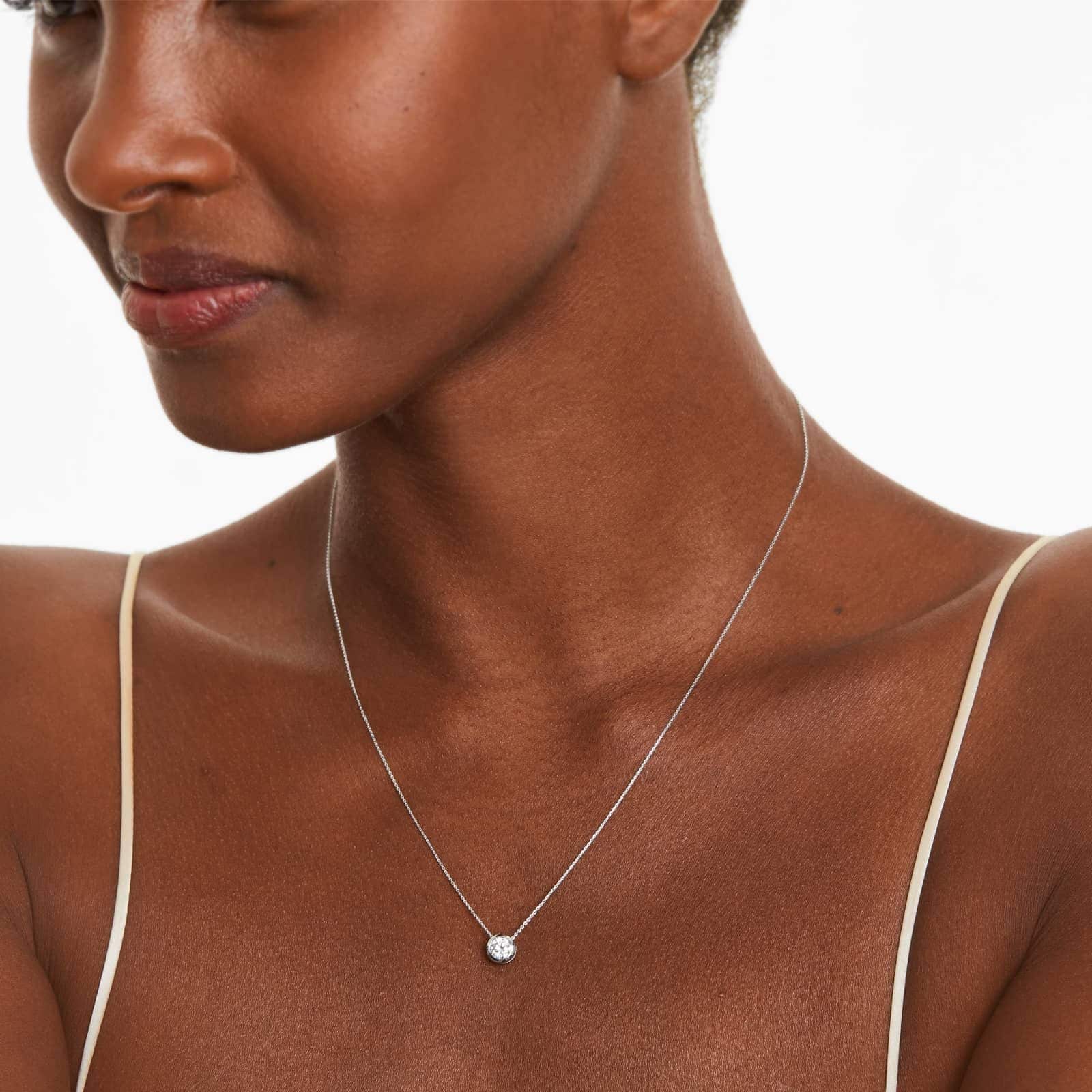 James Allen 14K White Gold Bezel Diamond Pendant (0.50 CTW) 3 A 0.50 CTW diamond appears to float in a secure 14K white gold bezel setting. Adjustable 16-18" chain.