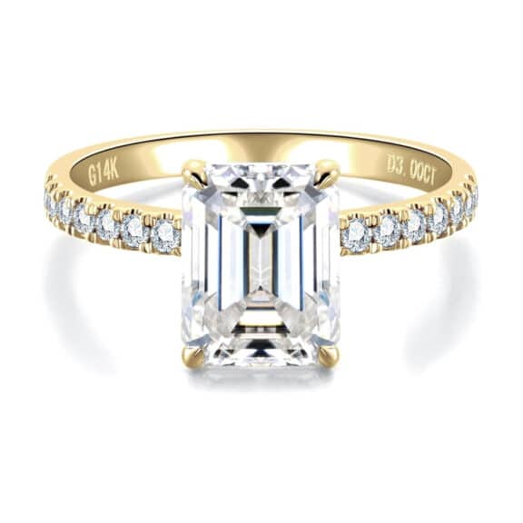 Elegant 3 carat emerald cut moissanite ring with side stones in 14K solid gold from CADYNO. Perfect for weddings & anniversaries.