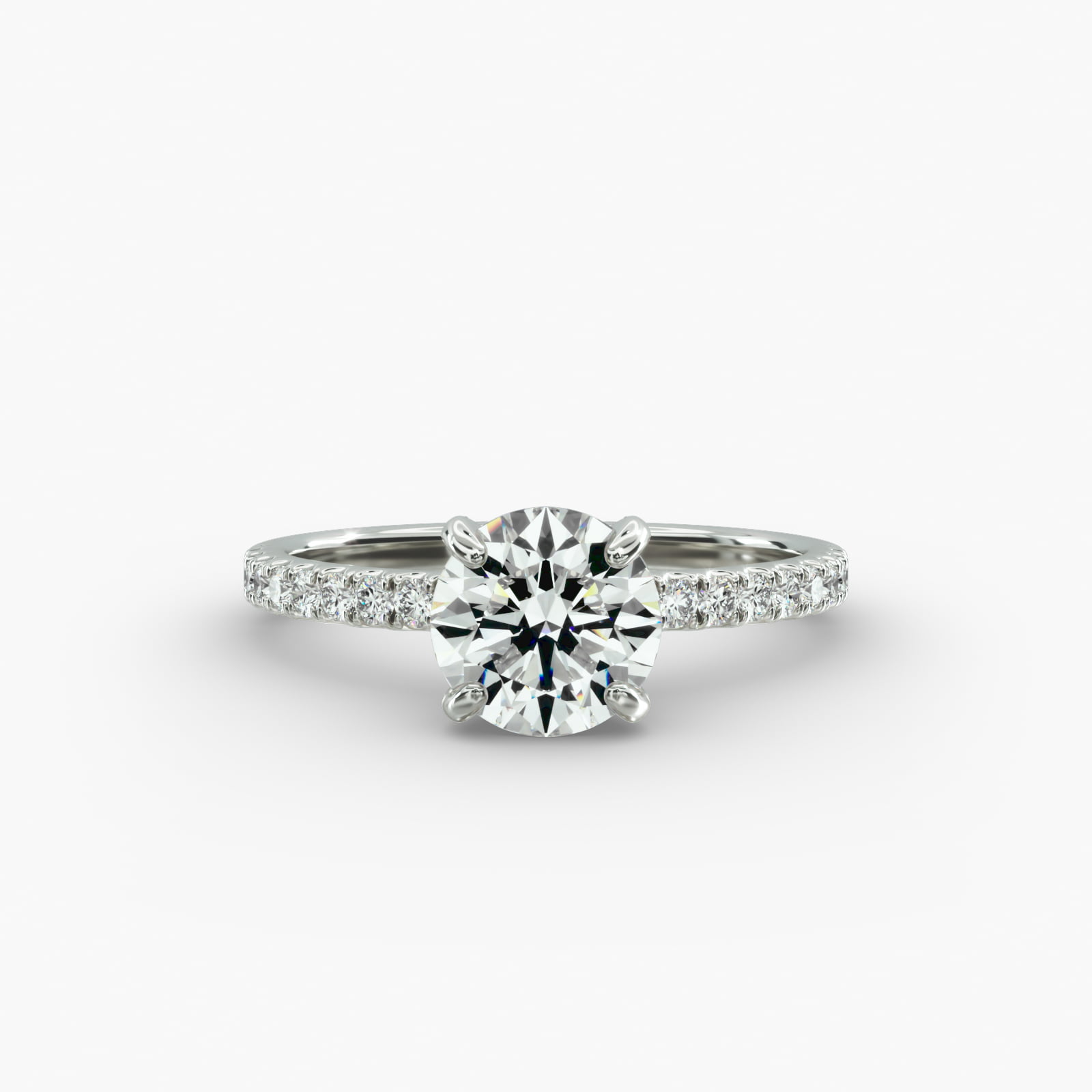 The Petite Pavé Crown hidden halo engagement ring in platinum with a round diamond.