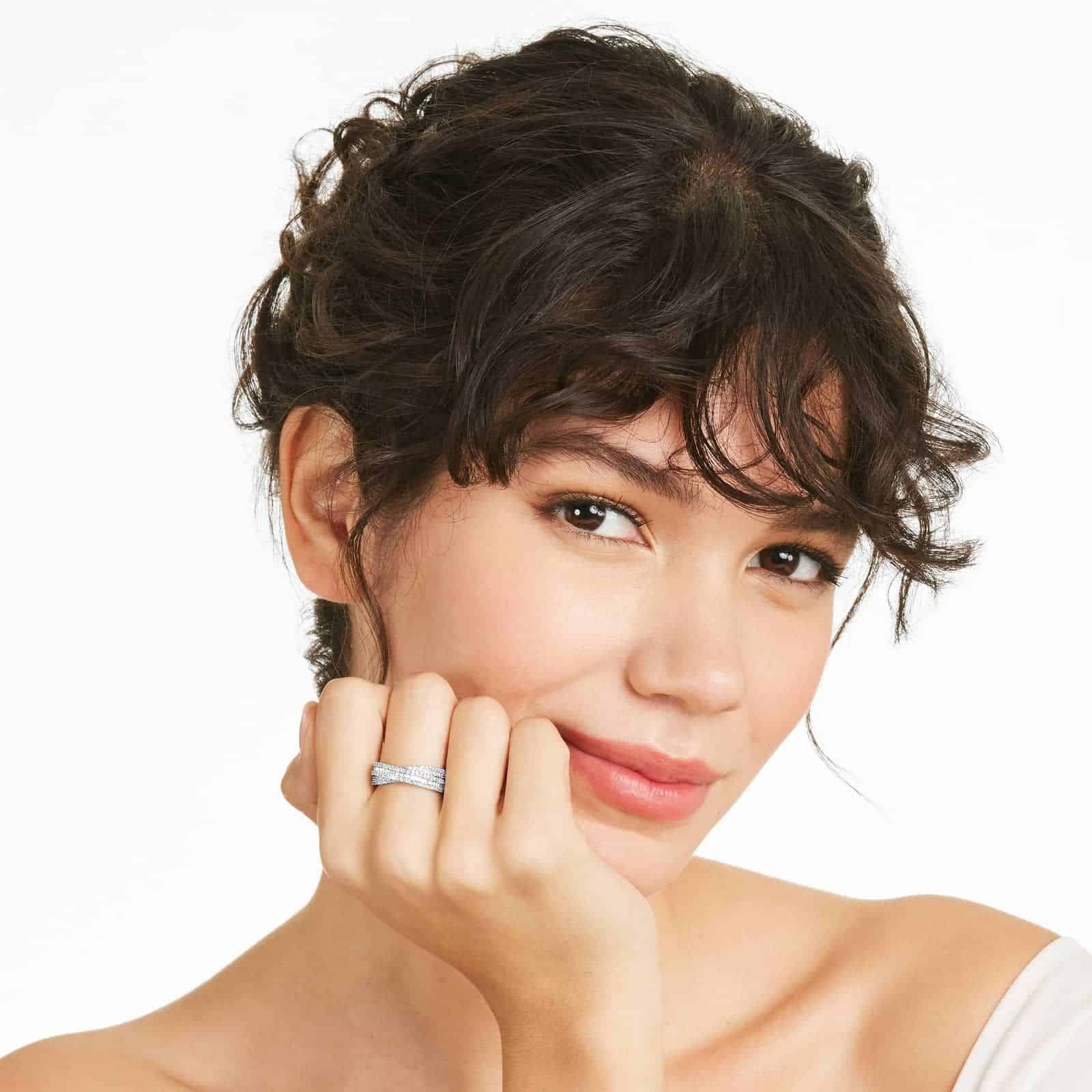 Cross Over Diamond Ring In 14K White Gold 2 A model wearing the 0.80 ctw crossover diamond statement ring on her index finger, showing how its wide, multi-band design looks on the hand.