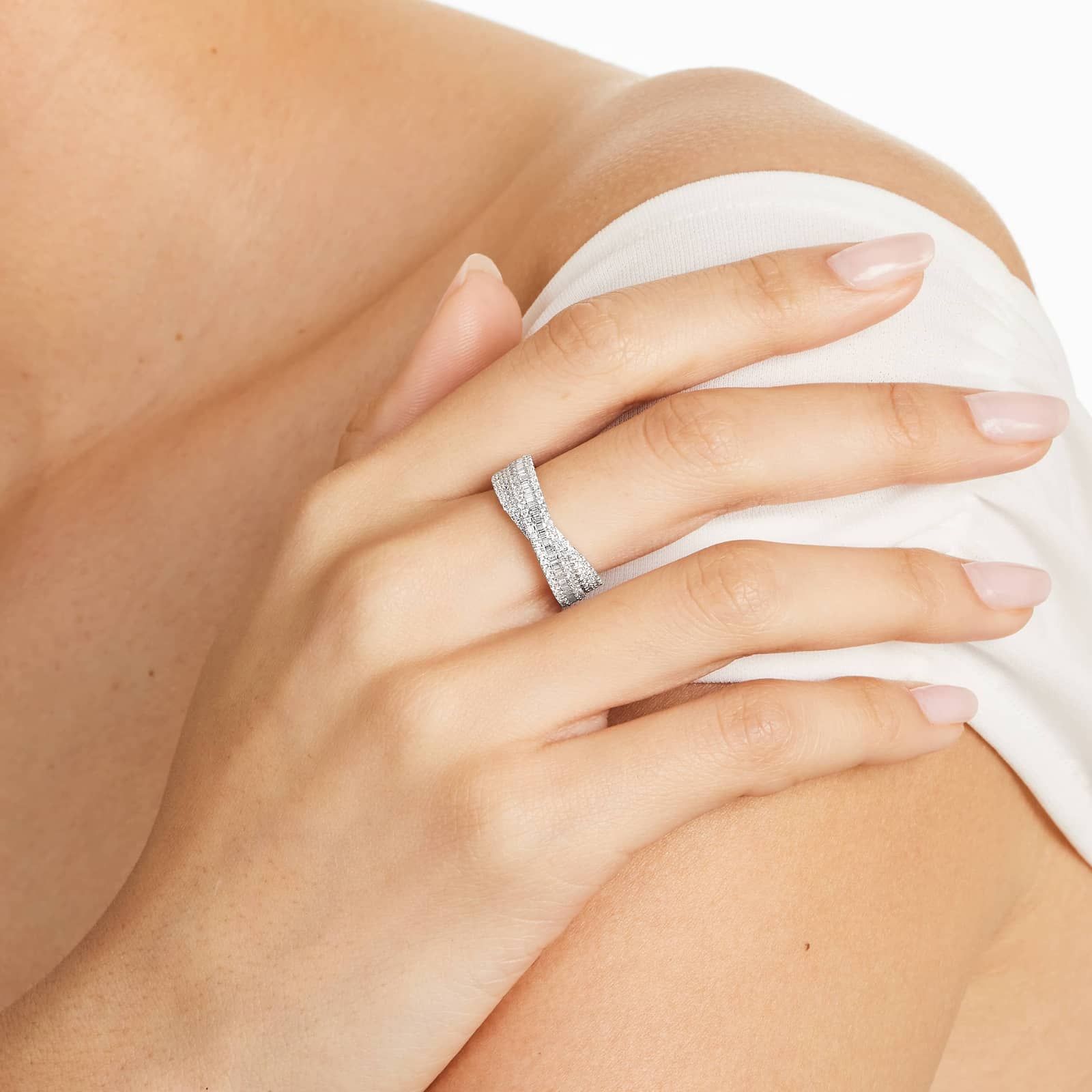 Cross Over Diamond Ring In 14K White Gold 3 A model wearing the 0.80 ctw crossover diamond statement ring on her index finger, showing how its wide, multi-band design looks on the hand.