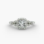 A high-resolution studio image of a GIA 1.50 carat cushion modified diamond engagement ring on a white background, highlighting the Ideal Cut and the intricate details of the halo and pavé setting.