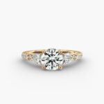 A professional studio image of a GIA 2.01 carat round diamond engagement ring on a white background, highlighting the Excellent Cut of the center stone and the intricate details of the lace bridge and pavé setting.