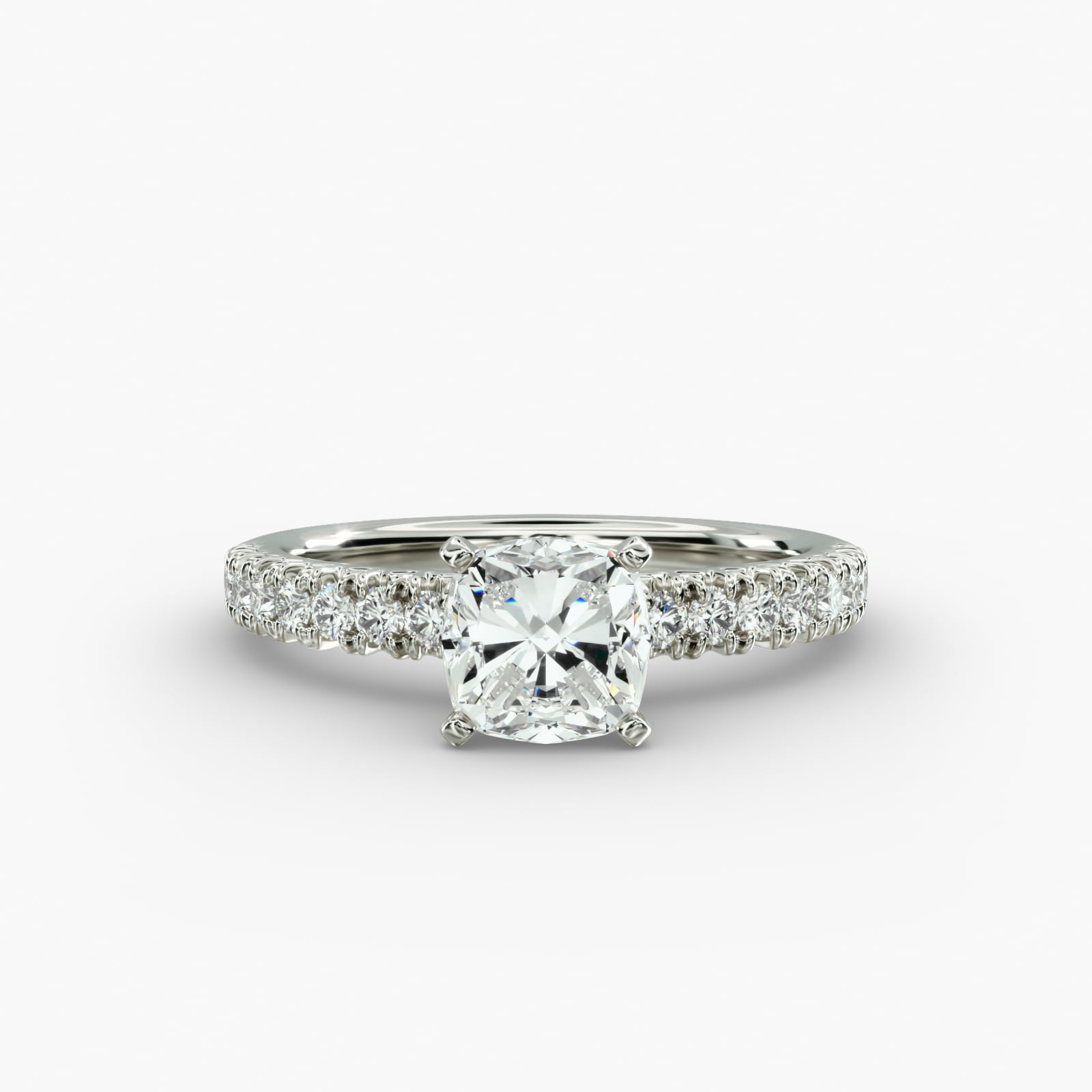 Close-up of a GIA 5.00 carat cushion modified diamond engagement ring on a white background, showcasing the intricate French pavé setting and the brilliant platinum craftsmanship.