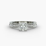 Close-up, high-magnification image of the GIA 5.02 carat E-FL cushion modified diamond ring on a white background, showcasing the "Ideal Cut" and flawless clarity of the center stone.