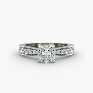Close-up, high-magnification image of the GIA 5.02 carat E-FL cushion modified diamond ring on a white background, showcasing the "Ideal Cut" and flawless clarity of the center stone.