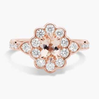 A close-up studio shot of a **Morganite Floral Engagement Ring** on a white background, highlighting the unique floral halo design and the brilliant sparkle of the diamonds.