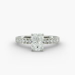 A close-up studio shot of a 3ct radiant cut diamond ring, highlighting the G-VVS2 clarity of the center stone and the intricate pavé setting.