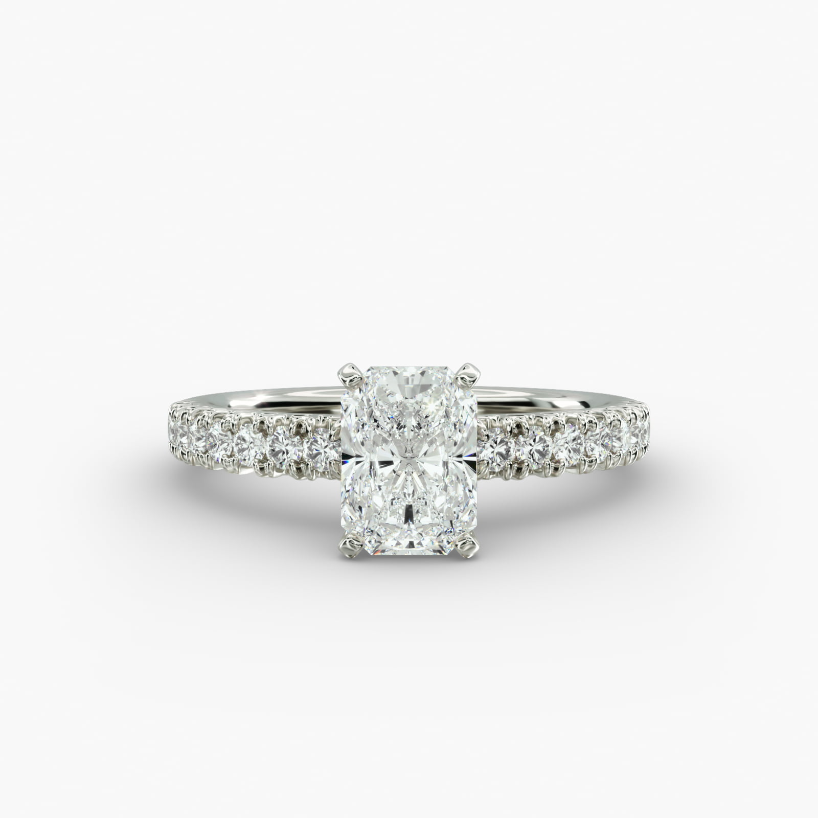 A close-up studio shot of a 3ct radiant cut diamond ring, highlighting the G-VVS2 clarity of the center stone and the intricate pavé setting.