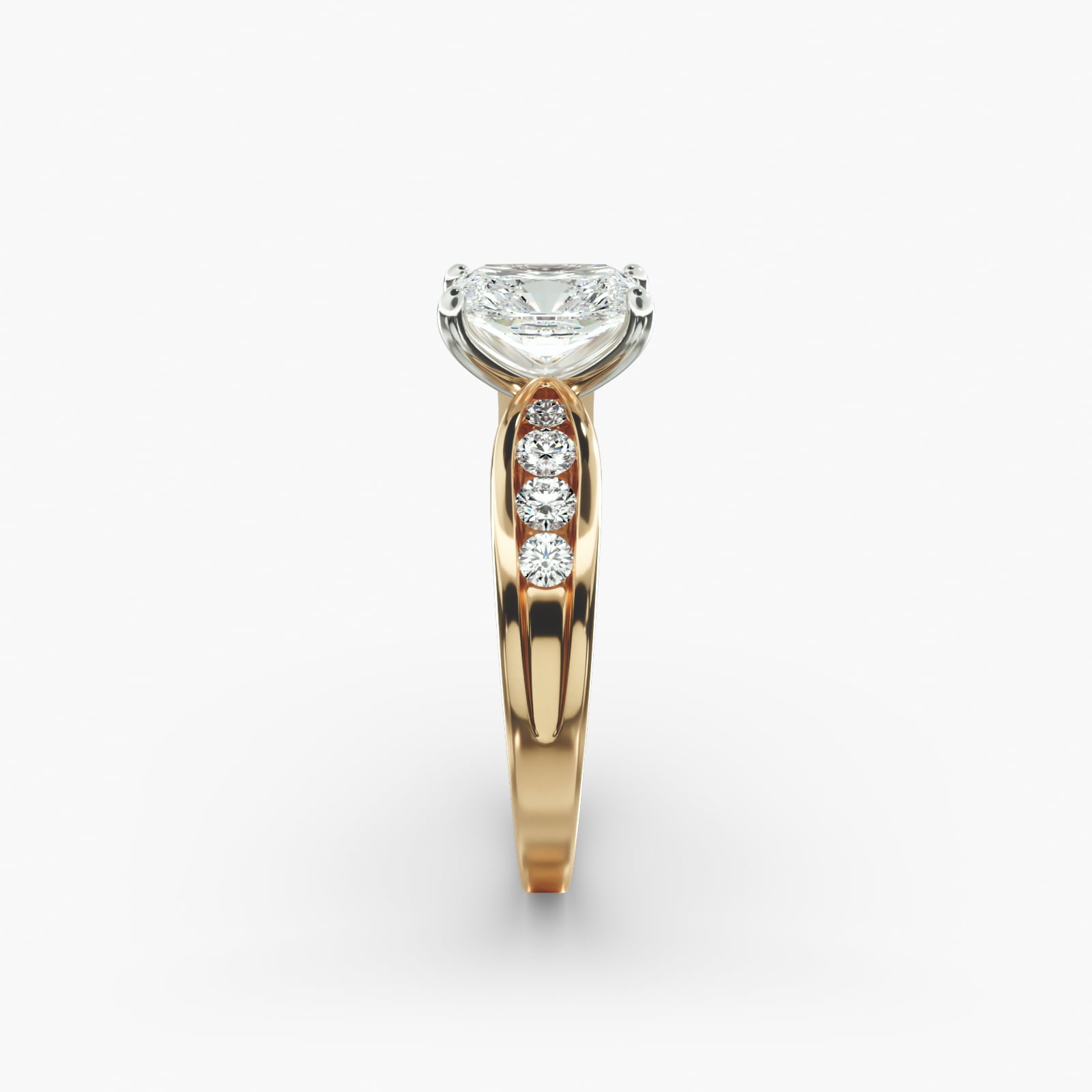 Bow-Tie 2.5 Carat Radiant Cut Diamond Ring with D-VS2 Diamond in Yellow Gold side view A close-up side view of a 2.5 carat radiant cut diamond ring in 14k yellow gold, highlighting the channel-set diamonds.