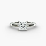 A close-up side view of a simple solitaire 2 carat princess cut lab-grown diamond engagement ring, highlighting the stone's setting in 14k white gold.
