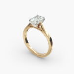 A close-up side view of a 3 ct radiant cut diamond ring, highlighting the Petite Cathedral setting and the elongated shape.