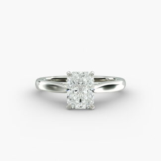 A close-up side view of a 4 carat radiant cut diamond ring, highlighting the secure prongs and the tapered 14k white gold band.