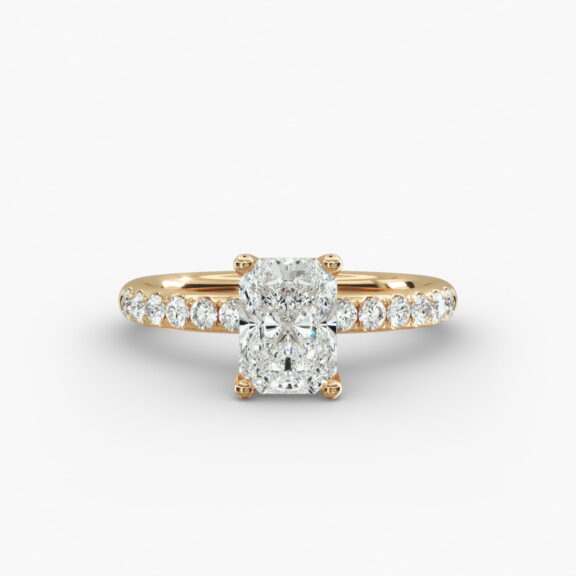 A close-up side view of a 3ct radiant cut diamond ring, showcasing the narrow 1.80mm yellow gold band and the subtle micropavé sparkle.