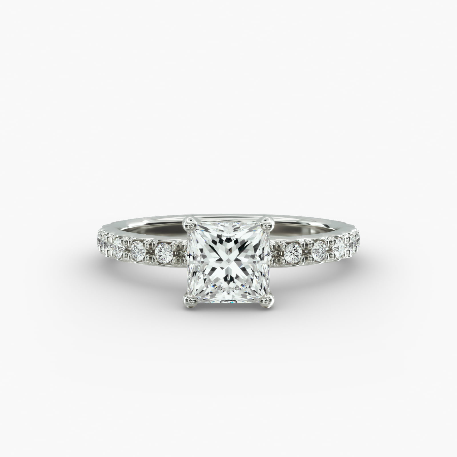 A close-up studio shot of a **7 carat diamond ring**, highlighting the sharp corners of the Princess cut diamond and the delicate detail of the French pavé side stones.