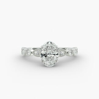 A close-up studio shot of a 7 carat diamond ring, highlighting the elegant shape of the oval diamond and the sparkling marquise side stones.