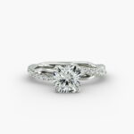A close-up side view of a 2 carat radiant cut diamond ring, highlighting the G-VS1 clarity of the center stone and the detailed Pavé Rope setting.