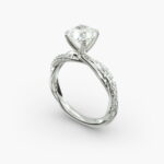 A close-up side view of a 2 carat radiant cut diamond ring, highlighting the G-VS1 clarity of the center stone and the detailed Pavé Rope setting.