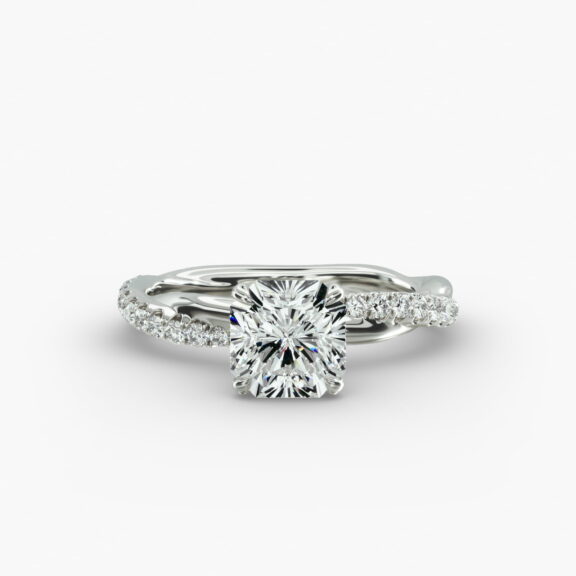 A close-up side view of a 2 carat radiant cut diamond ring, highlighting the G-VS1 clarity of the center stone and the detailed Pavé Rope setting.
