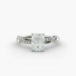 A close-up side view of a 2 carat radiant cut diamond ring, highlighting the F-VS1 clarity of the center stone and the elegant twist setting.