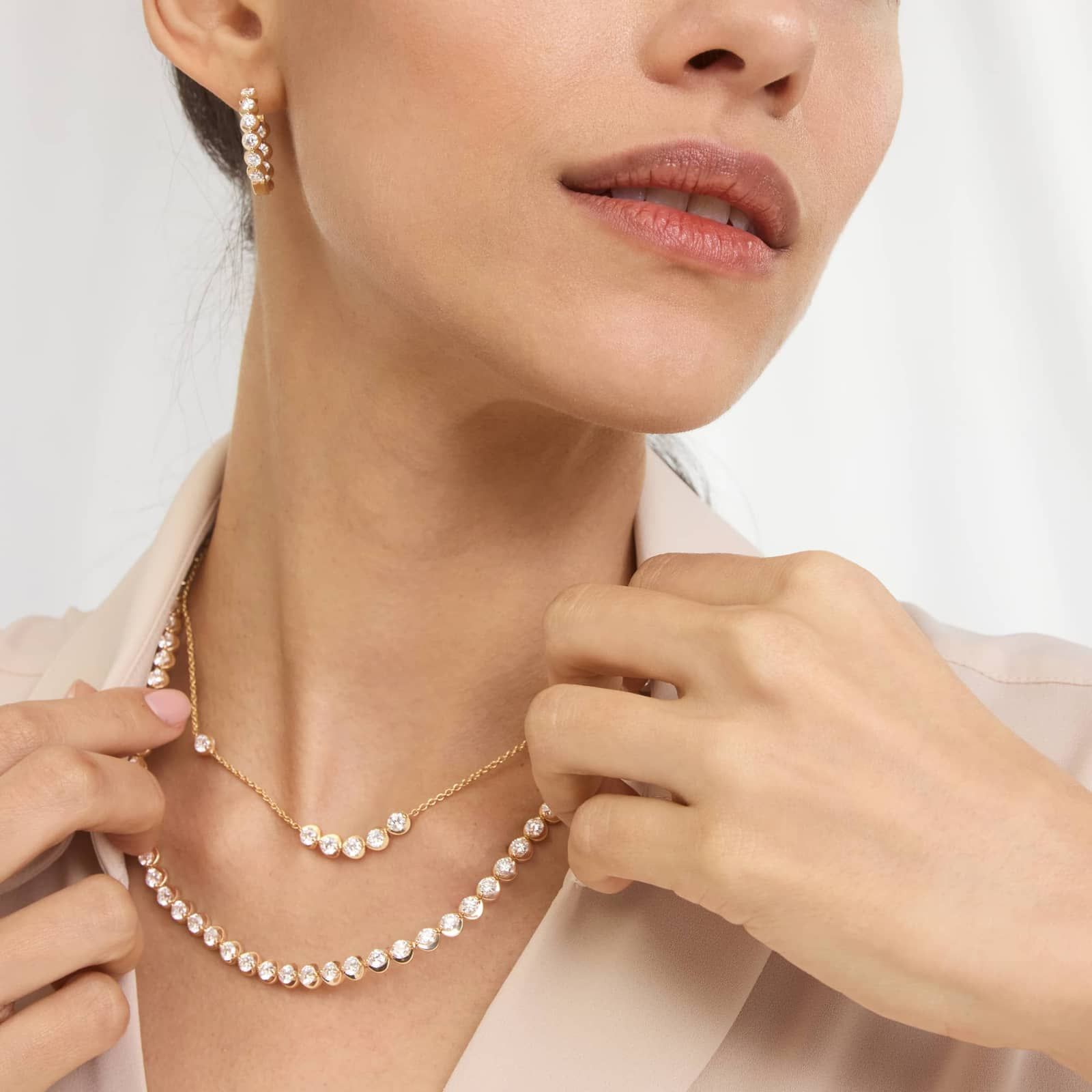20 CTW Illusion Lab Created Diamond Tennis Necklace 2 A woman wearing a spectacular 14K Yellow Gold lab created diamond tennis necklace with 80 round lab-grown diamonds totaling 20 CTW in an illusion setting.