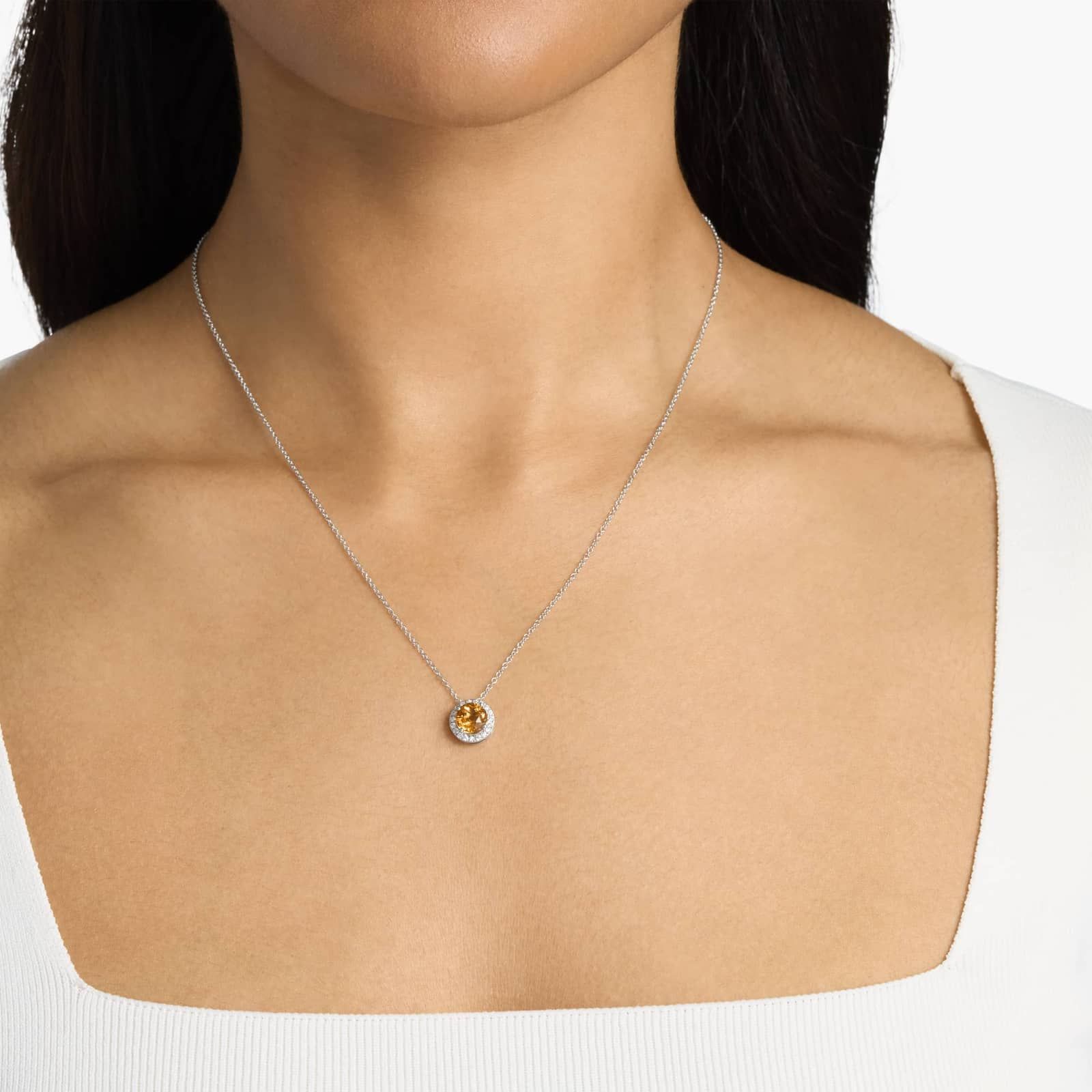 Citrine and Diamond Halo Pendant in 14k White Gold model view A Citrine and Diamond Halo Pendant in 14K White Gold, featuring a 1.2 CTW citrine, a classic suggestion among Luxury Push Present Ideas.