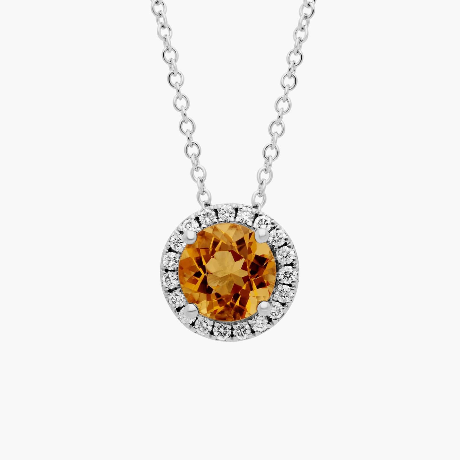 Citrine and Diamond Halo Pendant in 14k White Gold A Citrine and Diamond Halo Pendant in 14K White Gold, featuring a 1.2 CTW citrine, a classic suggestion among Luxury Push Present Ideas.