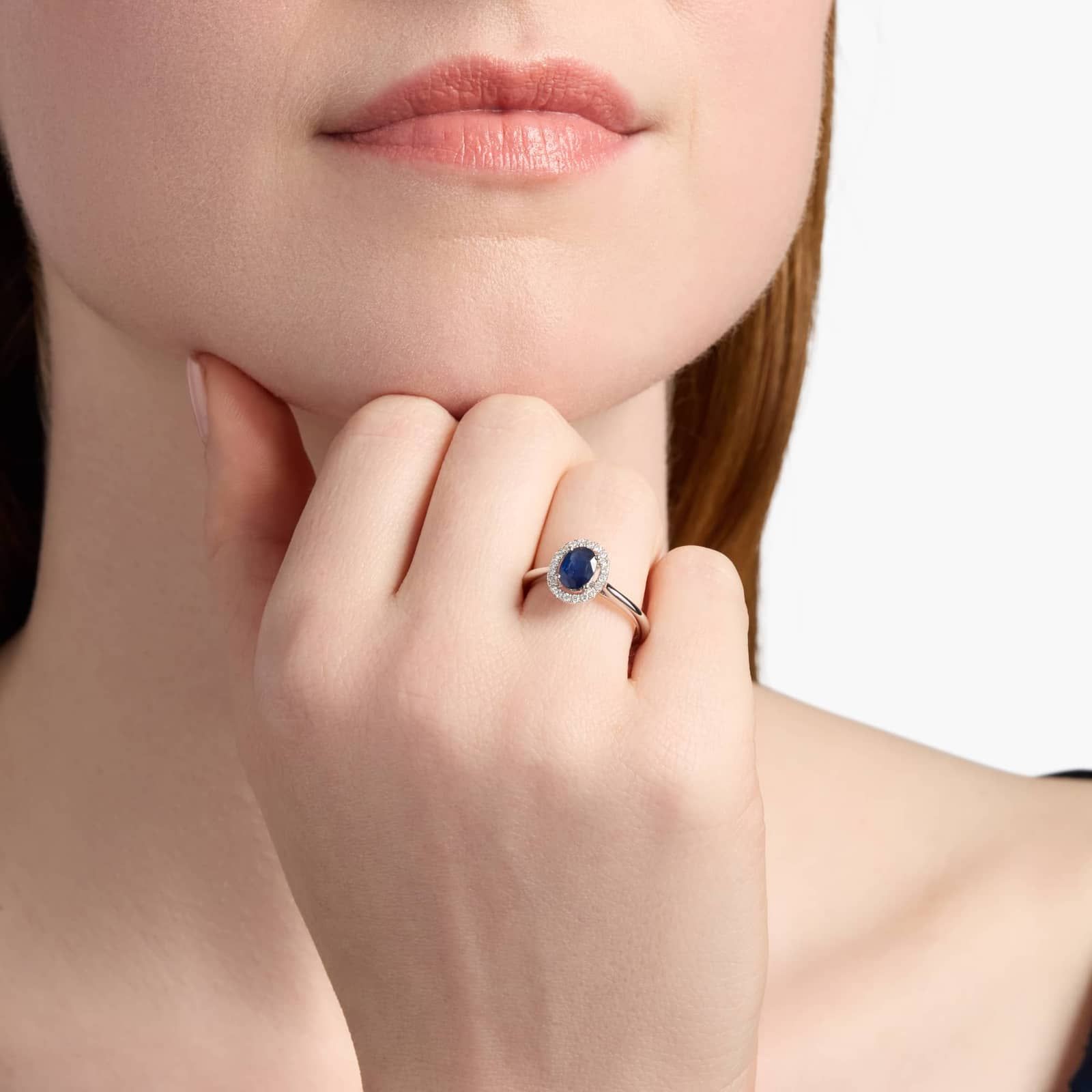 A Floating Oval Sapphire and Diamond Micropavé Halo Ring (7x5mm sapphire, 0.14 CTW diamond) in 14K White Gold, a colorful and elegant option among Luxury Push Present Ideas.