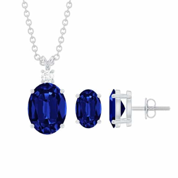 An 18K Solid White Gold Blue Sapphire Earrings and Necklace Set featuring Oval Lab Grown Blue Sapphires (AAAA quality, 2.75 CT total) with Moissanite accents in a solitaire design. Comes with a gift box.
