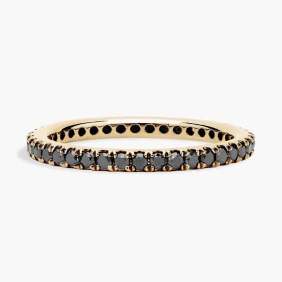 A Riviera Noir Pavé Black Diamond Black Wedding Rings For Women band (1.50mm) in 18K Yellow Gold with 0.50 CTW black diamonds.