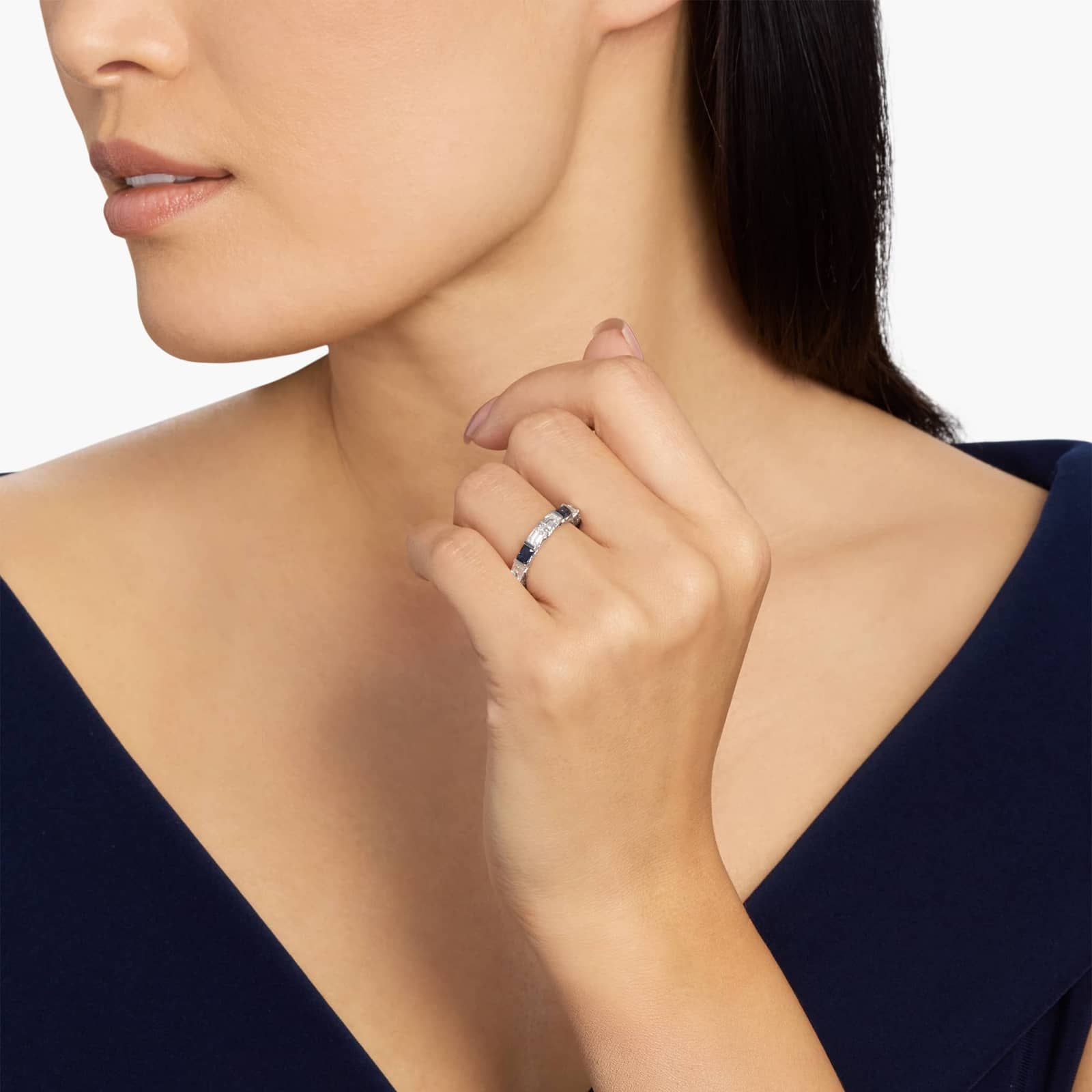alternating-emerald-cut-sapphire-diamond-blue-wedding-rings-for-women model view 2 An Alternating East-West Emerald Cut Sapphire and Diamond Blue Wedding Rings For Women band (3.30mm) in 14K White Gold with over 2.5 CTW of stones.