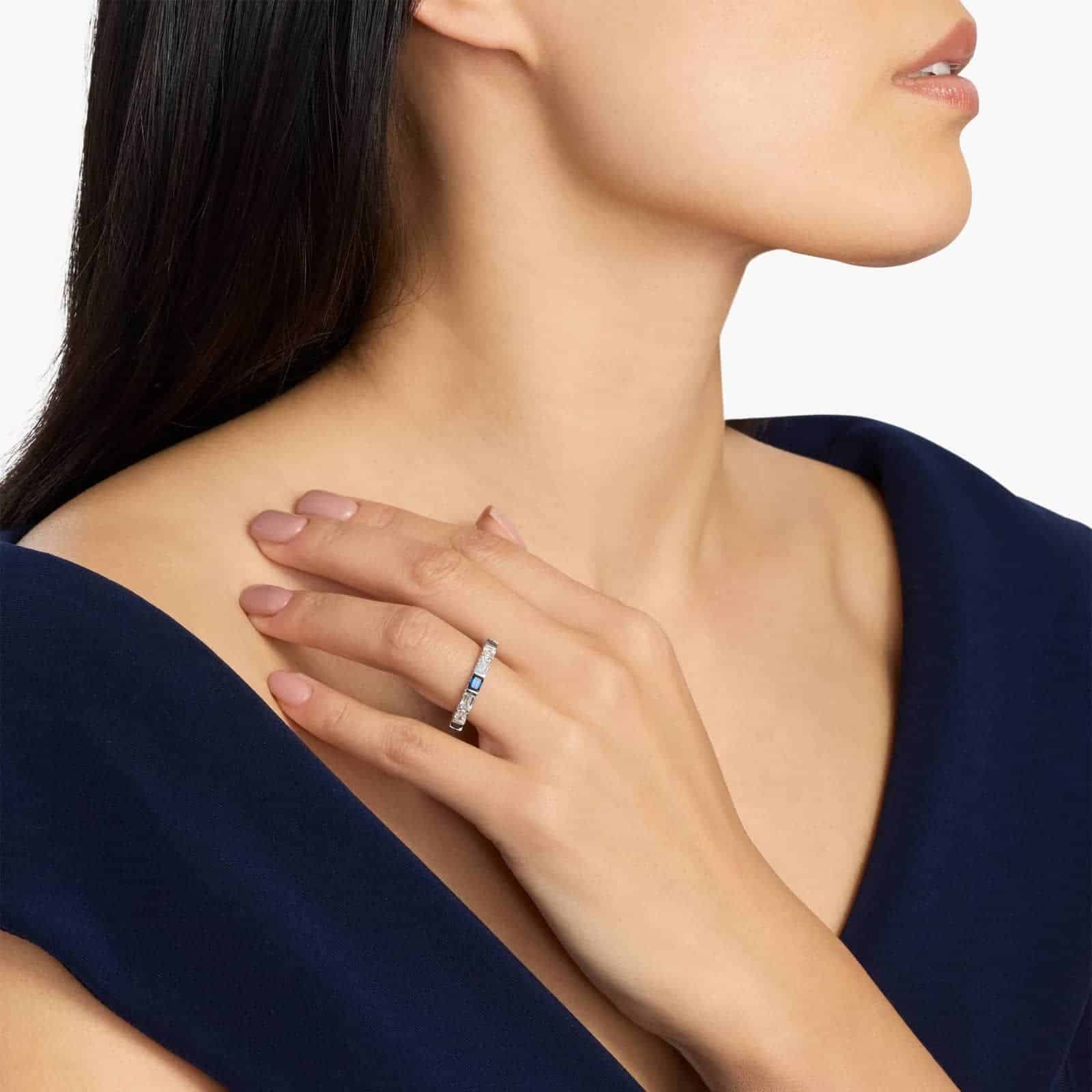 alternating-emerald-cut-sapphire-diamond-blue-wedding-rings-for-women model view An Alternating East-West Emerald Cut Sapphire and Diamond Blue Wedding Rings For Women band (3.30mm) in 14K White Gold with over 2.5 CTW of stones.