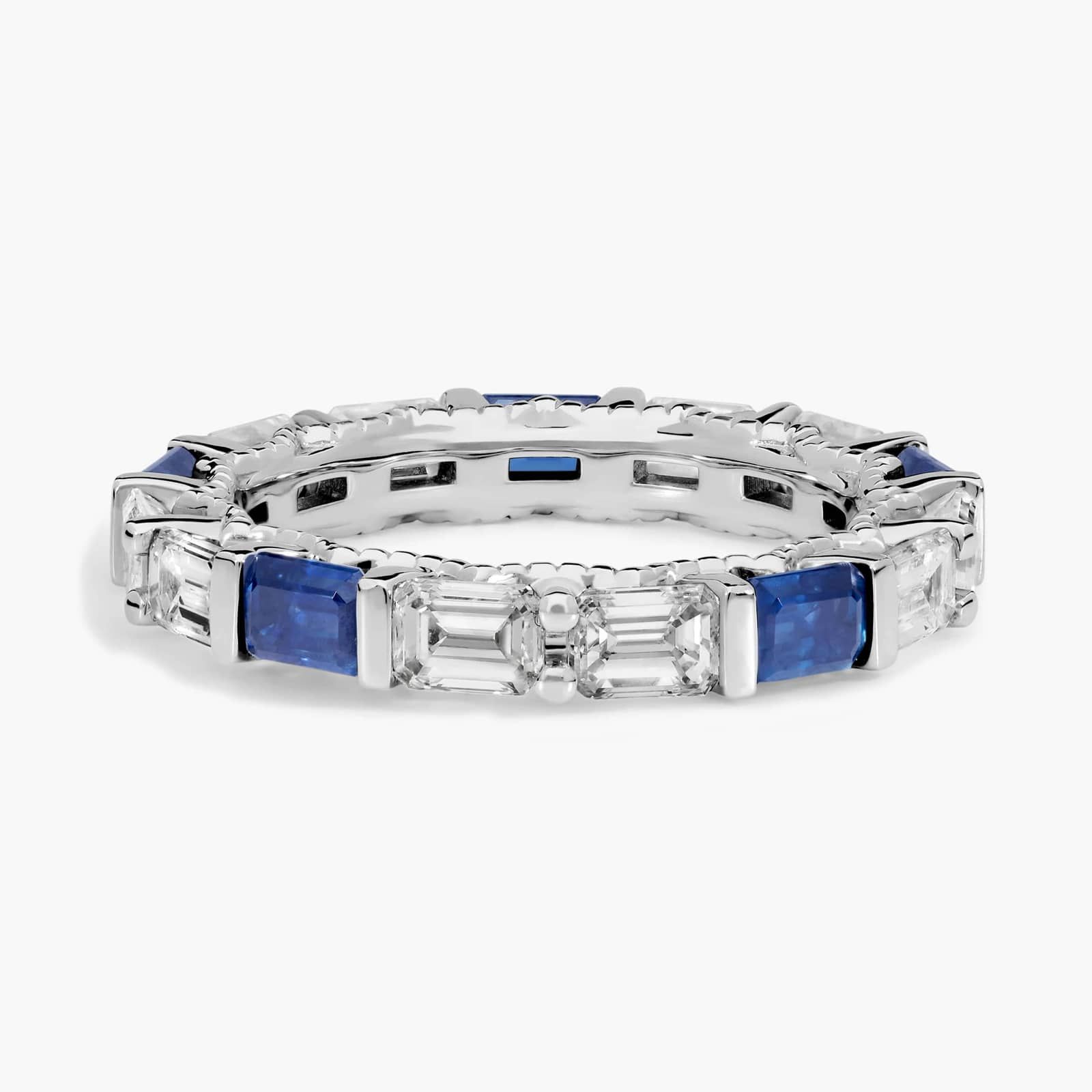 alternating-emerald-cut-sapphire-diamond-blue-wedding-rings-for-women An Alternating East-West Emerald Cut Sapphire and Diamond Blue Wedding Rings For Women band (3.30mm) in 14K White Gold with over 2.5 CTW of stones.