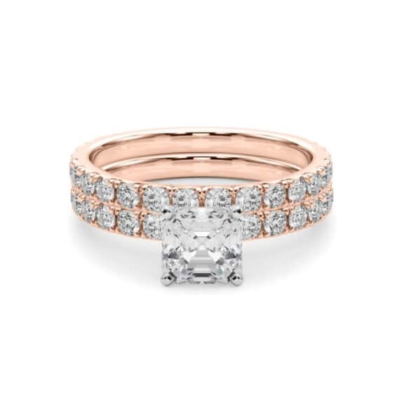 A 14K Rose Gold Cushion Cut Engagement Rings With Wedding Band set, featuring a large Cushion Cut Lab-Grown Diamond solitaire and a 0.5 ct diamond matching wedding band.