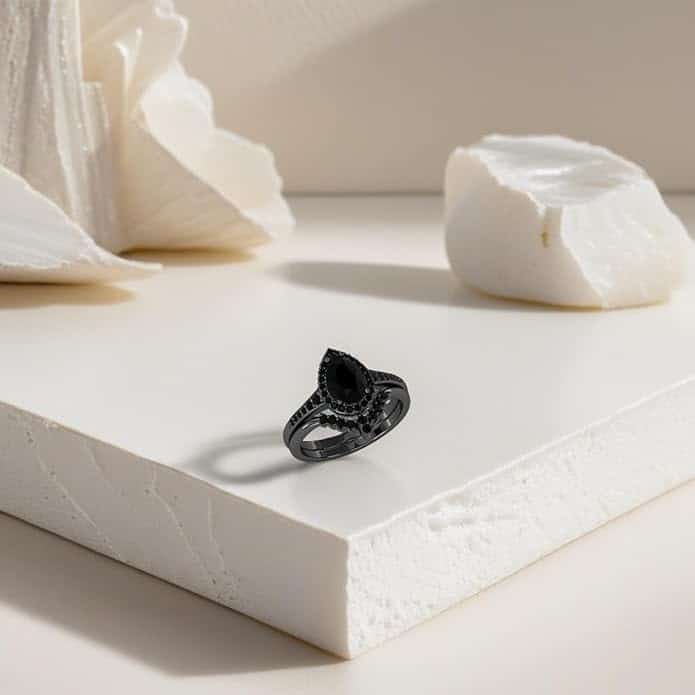 A 3.0 CT Drop-Tear Black Onyx and AAAAA Moissanite Black Wedding Ring Set For Her in 925 Sterling Silver with a Black Gold plating option.