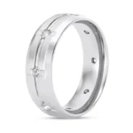 A 7mm wide 14K White Gold Diamond Wedding Rings For Women eternity band with a grooved design and 0.5 CTW natural round diamonds.