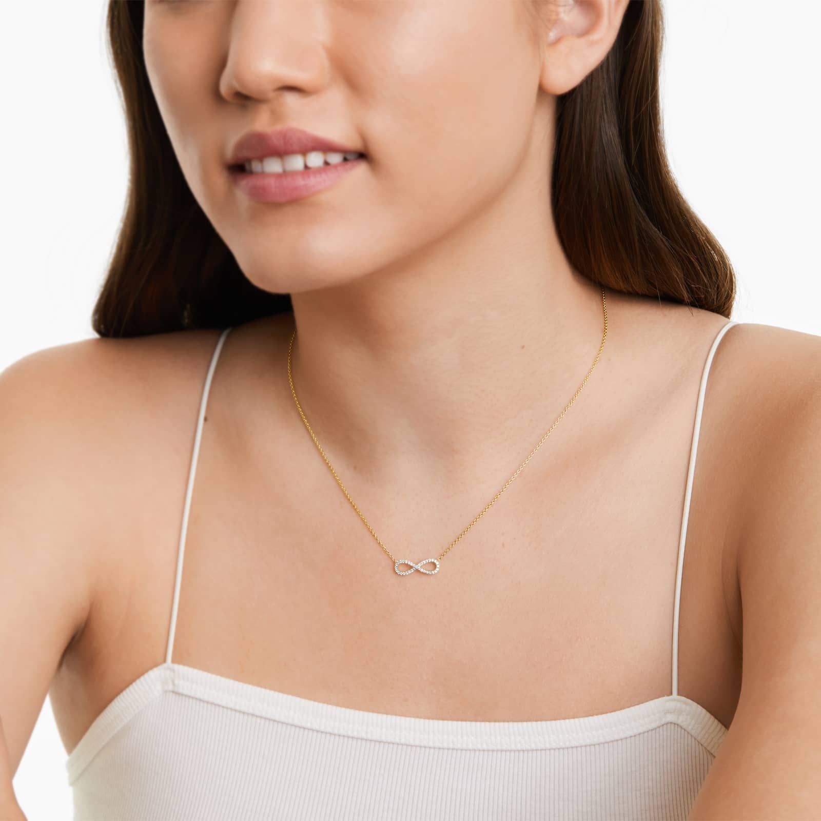 pave-diamond-infinity-necklaces-valentines-day-jewelry-for-her-14k-yellow-gold MODEL VIEW 2 14K yellow gold infinity necklaces valentine's day jewelry for her featuring a diamond pavé infinity symbol on a 16-inch cable chain.