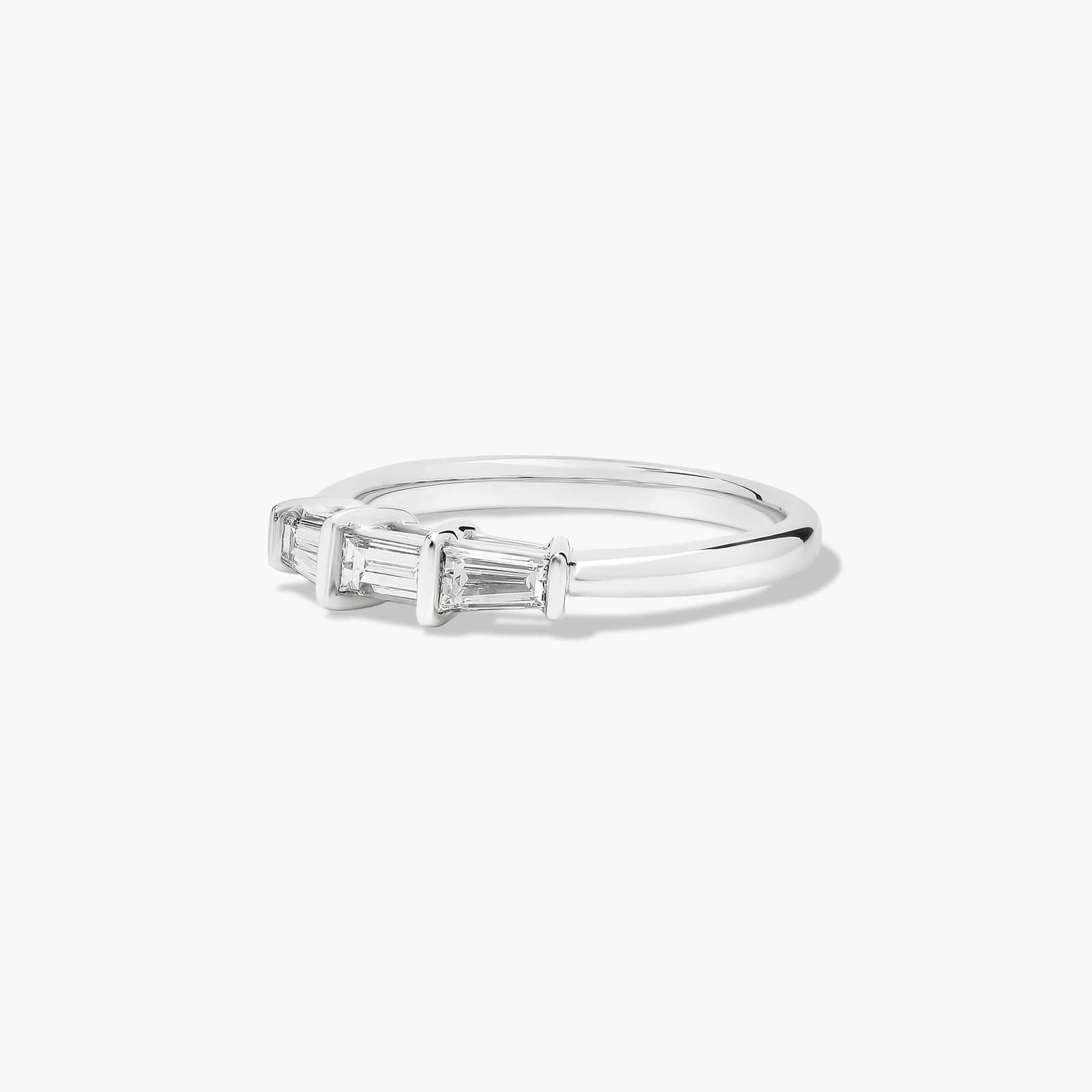 platinum-diamond-tapered-baguette-wedding-band-0-33ctw 2 A 2.00 mm Platinum Tapered Baguette Wedding Band featuring three Natural Tapered Baguette Diamonds totaling 0.33 CTW.