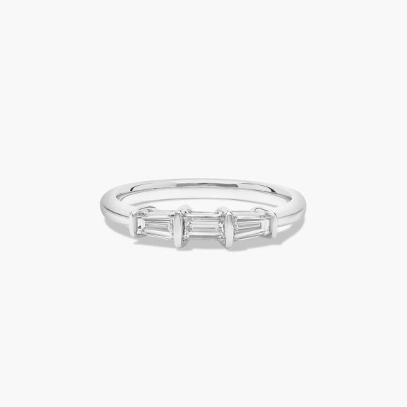 A 2.00 mm Platinum Tapered Baguette Wedding Band featuring three Natural Tapered Baguette Diamonds totaling 0.33 CTW.