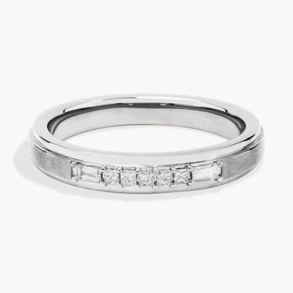 A 3.60 mm wide Platinum Mens Wedding Bands With Baguettes featuring an alternating pattern of Baguette and Princess Cut natural diamonds (1/5 CTW).