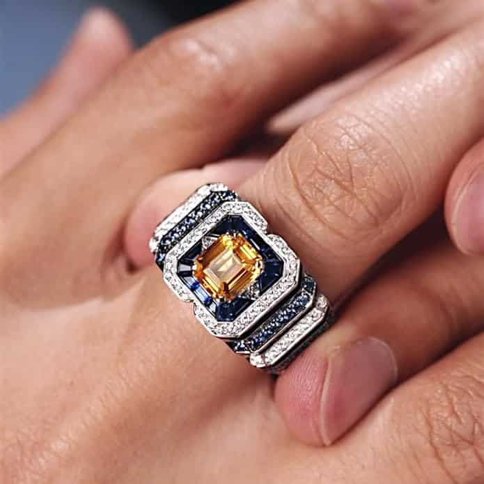 rectangular-halo-created-yellow-sapphire-ring-for-men-sterling-silver-1-carat model view A 0.925 Sterling Silver Yellow Sapphire Ring for Men: a 1 Carat Rectangular Created Yellow Sapphire set in a Halo style, with an Eye Clean clarity grade.