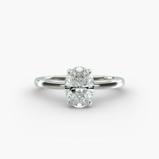 Platinum oval solitaire engagement rings under $2,500 featuring a 1.5 carat colorless VS clarity lab grown diamond with claw prongs and a flush fit band.