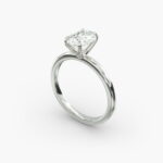 Platinum oval solitaire engagement rings under $2,500 featuring a 1.5 carat colorless VS clarity lab grown diamond with claw prongs and a flush fit band.