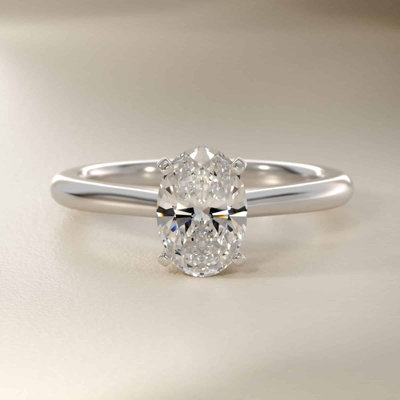 Oval Cut 1.5 CT Certified Lab-Grown Diamond Petite Solitaire Engagement Ring In Platinum Platinum oval solitaire engagement rings under $2,500 featuring a 1.5 carat oval lab-grown diamond on a 1.80mm petite band.