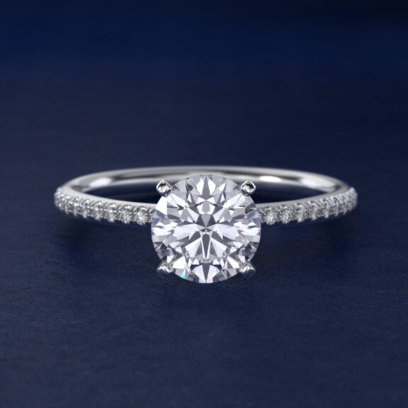 Platinum round micropavé engagement rings under $2,500 featuring a 1 carat round lab-grown diamond and 22 natural diamond accents on a 1.70mm band.