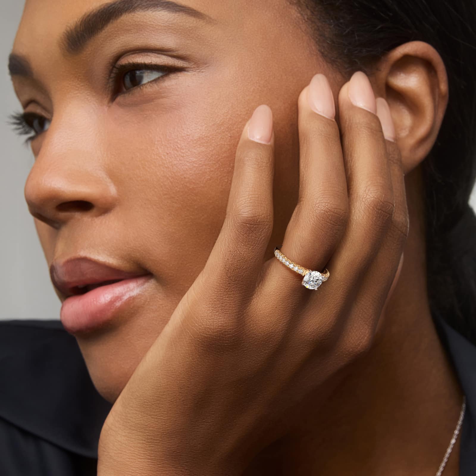 Round 1 CT Lab Grown Diamond French Pavé 14K Yellow Gold Ring - Engagement Rings Under $2,500 model view 2 14K yellow gold French pavé engagement rings under $2,500 featuring a 1 carat round lab grown diamond and 16 natural diamond accents in model view.