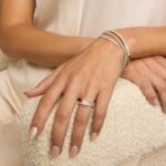 14K white gold petite twist engagement rings under $2,500 featuring a 1.5 carat round lab grown diamond and 20 pavé natural diamonds on a 2.80mm shank.