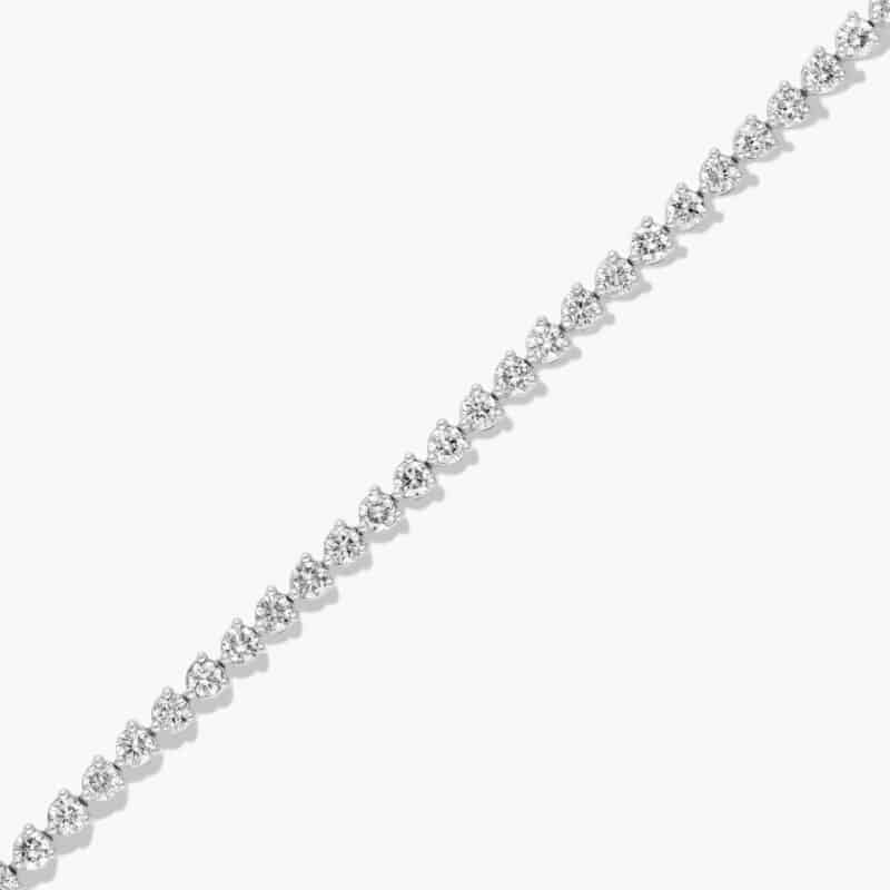 14K white gold round lab grown diamond tennis bracelets under $3000 featuring 4 CTW of brilliant diamonds and a floral box clasp.