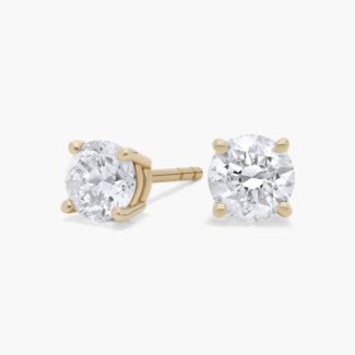 Enhance your everyday elegance with our stunning 1 ct total weight diamond earrings, featuring two brilliant round natural diamonds set in classic 14K yellow gold with secure Guardian backs.