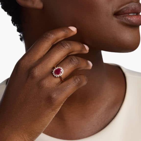 Oval Ruby and Diamond Sunburst Halo Ring in 14k Rose Gold